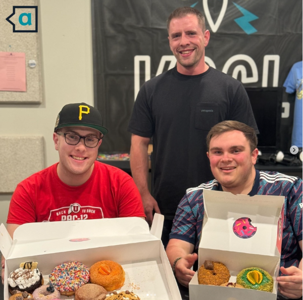 Isaac, Robbie, and Thatcher holding a box of donuts