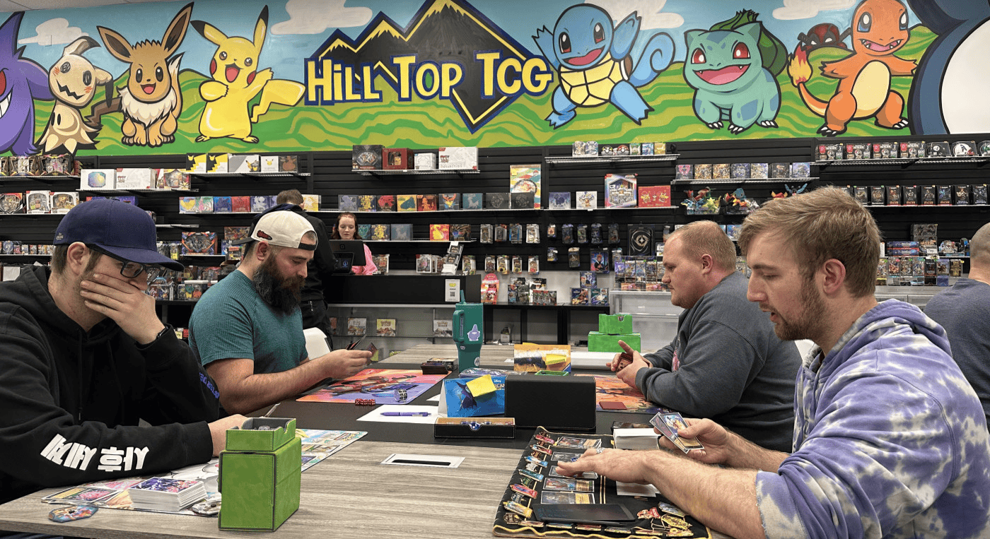 Lorcana enthusiasts engage in a heated game during a community league night at Hill Top TCG in Riverdale, Utah.